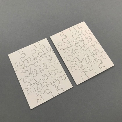 Two Puzzles: the image of one puzzle printed on another and vice versa by Micah Lexier